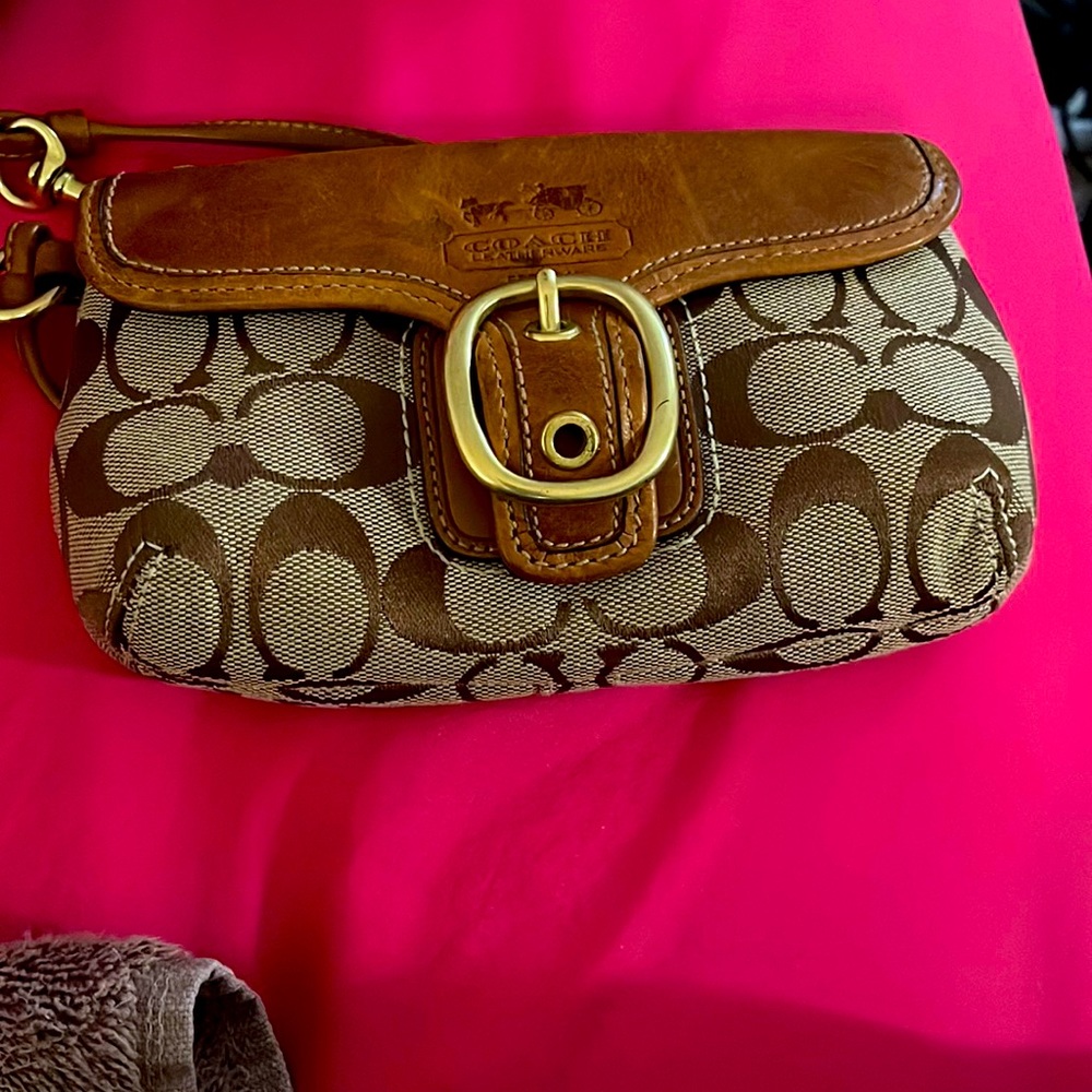Used a few times Coach wallet wristlet but in good condition